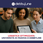 Persone che guardano un tablet in un magazzino analizzando dati nell'ambito di un progetto per la logistica integrata promosso da DebbyLine e università di Padova